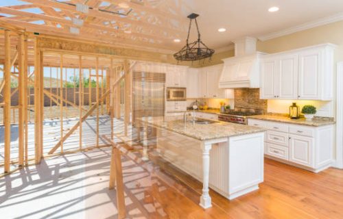 House Construction Framing Gradating Into Finished Kitchen Build.