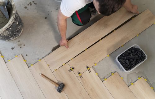 top-view-man-tiling-floor