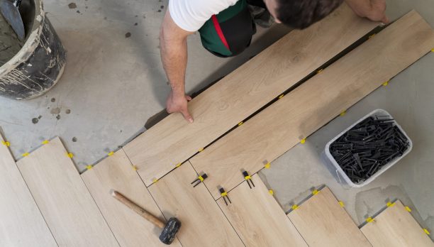 top-view-man-tiling-floor